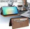 A desk setting with a laptop, phone case, and other office items. Produktbild-Vorschau