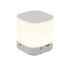 A white LED night light with a touch-sensitive top and USB charging ports on the side. Voir les images du produit