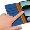 A hand is shown interacting with a flip case for a smartphone, revealing card slots. Podgląd zdjęcia produktu