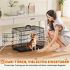 A woman is interacting with a small dog next to a dog crate in a home setting. Produktbild-Vorschau