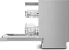 Side view of an open dishwasher with racks extended, showing clean dishes. Produktbild-Vorschau