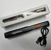 A black LED inspection lamp with an orange button and a USB charging cable is shown on a white and light gray background. A product box is partially visible in the background. Produktbild-Vorschau
