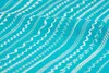A close-up view of various decorative stitches on turquoise fabric. Produktbild-Vorschau