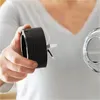 A person is holding a blender blade assembly near a glass blender jar. Anteprima dell’immagine prodotto