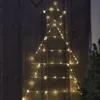 A string of lights in the shape of a Christmas tree with a star on top, mounted on a wooden wall. Podgląd zdjęcia produktu