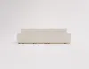 A cream-colored sectional sofa viewed from the back, set against a plain white background. Náhled obrázku produktu
