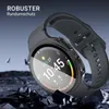 A smartwatch with a protective case is shown against a dark, rocky background, with shards of material flying off. Produktbild-Vorschau
