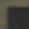 A close-up view of a rug, showing the texture of the fabric and the backing. Produktbild-Vorschau