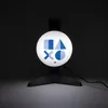 A black headset stand with a circular illuminated light featuring the PlayStation logo symbols. Anteprima dell’immagine prodotto
