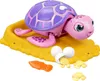 A toy turtle and its babies on a yellow sandy base. Produktbild-Vorschau