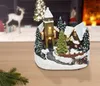 Village LED avec mouvement et arbre tournant - 19 cm - Voir les images du produit 2