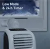A portable air conditioner placed near a window at night. Produktbild-Vorschau