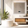 A modern bathroom with a freestanding tub, a vanity with a wooden cabinet, and a large LED-lit mirror. Anteprima dell’immagine prodotto