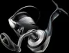 A studio shot of a fishing reel against a black background. Náhled obrázku produktu