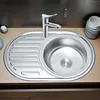A stainless steel kitchen sink with a faucet and a drying rack. Produktbild-Vorschau