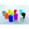 A collection of colorful mini trash cans arranged on a light gray surface with a white background. Produktbild-Vorschau