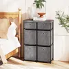 A bedroom scene with a dresser and a bed. Anteprima dell’immagine prodotto