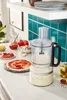 A KitchenAid food processor is shown on a kitchen counter, surrounded by ingredients for making pizza. Anteprima dell’immagine prodotto
