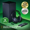 An Xbox Series X console, a pair of Steelseries Arctis Nova 7X headphones, a wireless dongle, and a smartphone are displayed on a green surface with a green background. There are several promotional badges and text overlays. Produktbild-Vorschau