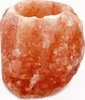 A close-up, studio shot of a round, carved salt lamp candle holder. Anteprima dell’immagine prodotto