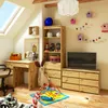 A child's room with a desk, shelves, and a dresser, decorated with birdhouses and toys. Podgląd zdjęcia produktu