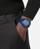 A person's wrist wearing a watch, with their hand in their pocket. Podgląd zdjęcia produktu