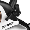 A close-up view of the pedal and crank arm of a stationary exercise bike. Produktbild-Vorschau