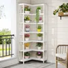 A white corner shelf unit filled with various potted plants, placed on an outdoor balcony or patio. Anteprima dell’immagine prodotto