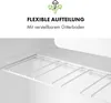 A close-up view of the interior of a white refrigerator with a wire shelf. Produktbild-Vorschau