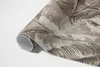 Pflanzenblätter und rohe Betontextur – Vinylteppich – 60x90 Produktbild-Vorschau 4