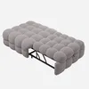 A gray upholstered daybed with a bubble-like design, shown from a side-diagonal angle against a light gray background. Podgląd zdjęcia produktu