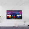 A smart TV is mounted on a marble wall above a sofa, displaying a colorful interface with various app icons. Anteprima dell’immagine prodotto