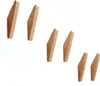 A group of six wooden hooks arranged in two staggered rows against a white background. Produktbild-Vorschau