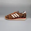 A side view of a single Adidas sneaker with a leopard print pattern. Podgląd zdjęcia produktu