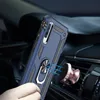 A hand holding a blue phone case with a ring holder, magnetically attached to a rose gold car mount on a car's air vent. Produktbild-Vorschau