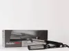 A hair curler and its packaging are displayed against a white background. Produktbild-Vorschau
