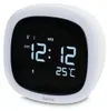 A white digital alarm clock with a black screen displaying the time, date, and temperature. Anteprima dell’immagine prodotto