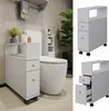 A bathroom setting with a toilet and a slim storage cabinet. Náhľad obrázku produktu