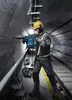 A construction worker in a tunnel using a demolition hammer. Produktbild-Vorschau