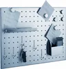 A metal pegboard with magnetic attachments, hooks, a small shelf, and a container, holding notes, keys, and a mobile phone. Produktbild-Vorschau