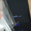 A close-up of a phone screen protector being applied to a smartphone. Produktbild-Vorschau