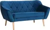 A blue velvet sofa with wooden legs is shown against a white background.