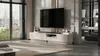 A modern living room with a TV stand and a large television. Produktbild-Vorschau
