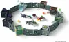 A circular arena made of modular gray walls, with various toy creatures and accessories inside. Produktbild-Vorschau