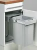 A pull-out trash can system installed in a kitchen cabinet. Voir les images du produit