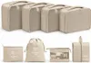 A set of beige luggage organizers and cosmetic bags are displayed against a white background. Anteprima dell’immagine prodotto