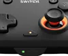 A close-up shot of a black Nintendo Switch controller, focusing on the directional pad, joystick, and indicator lights. Produktbild-Vorschau