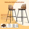 Two brown bar stools with black metal frames are shown against an orange and white background. Text overlays describe the product's features. Podgląd zdjęcia produktu