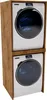 A stacked washing machine and dryer unit housed within a wooden cabinet. Náhled obrázku produktu