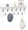 A white wall-mounted shelf with coat hooks, a decorative vase, a framed picture, a hat, and a bag hanging from a hook. Voir les images du produit